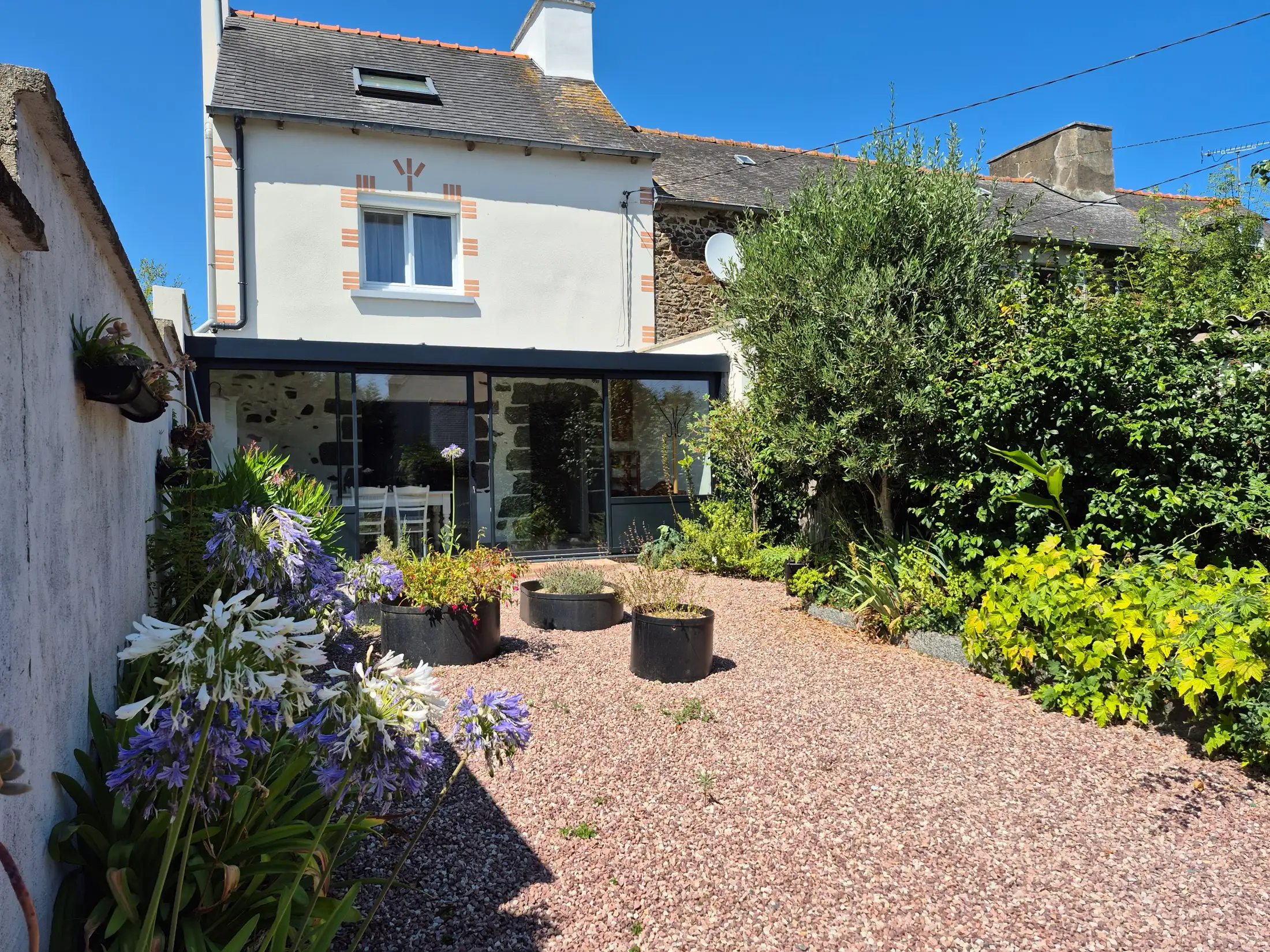 The gîte's enclosed courtyard, with the veranda