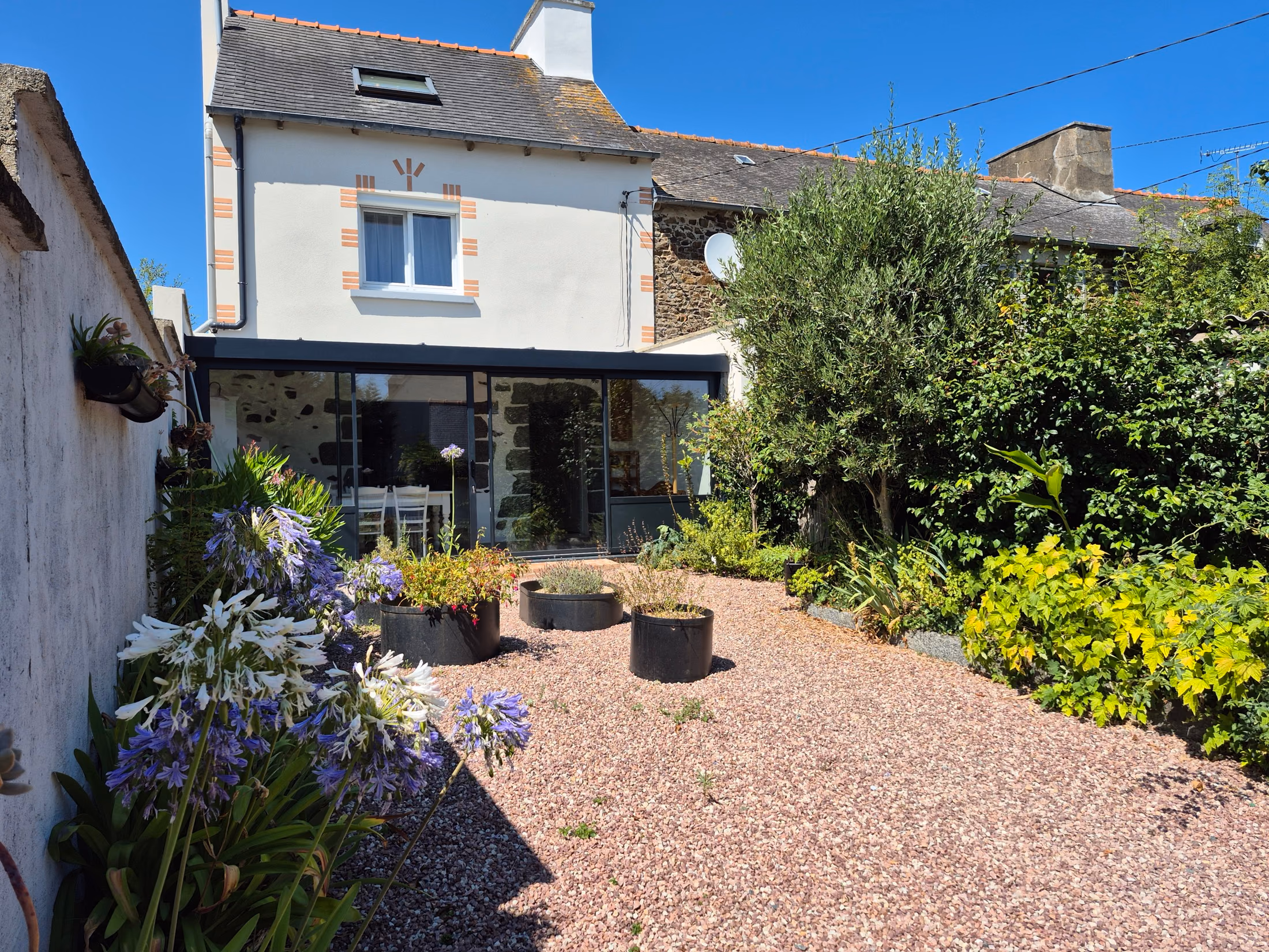 The gîte's enclosed courtyard, with the veranda